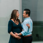 expecting mother being hugged by expecting father, Northern Virginia Obstetricians