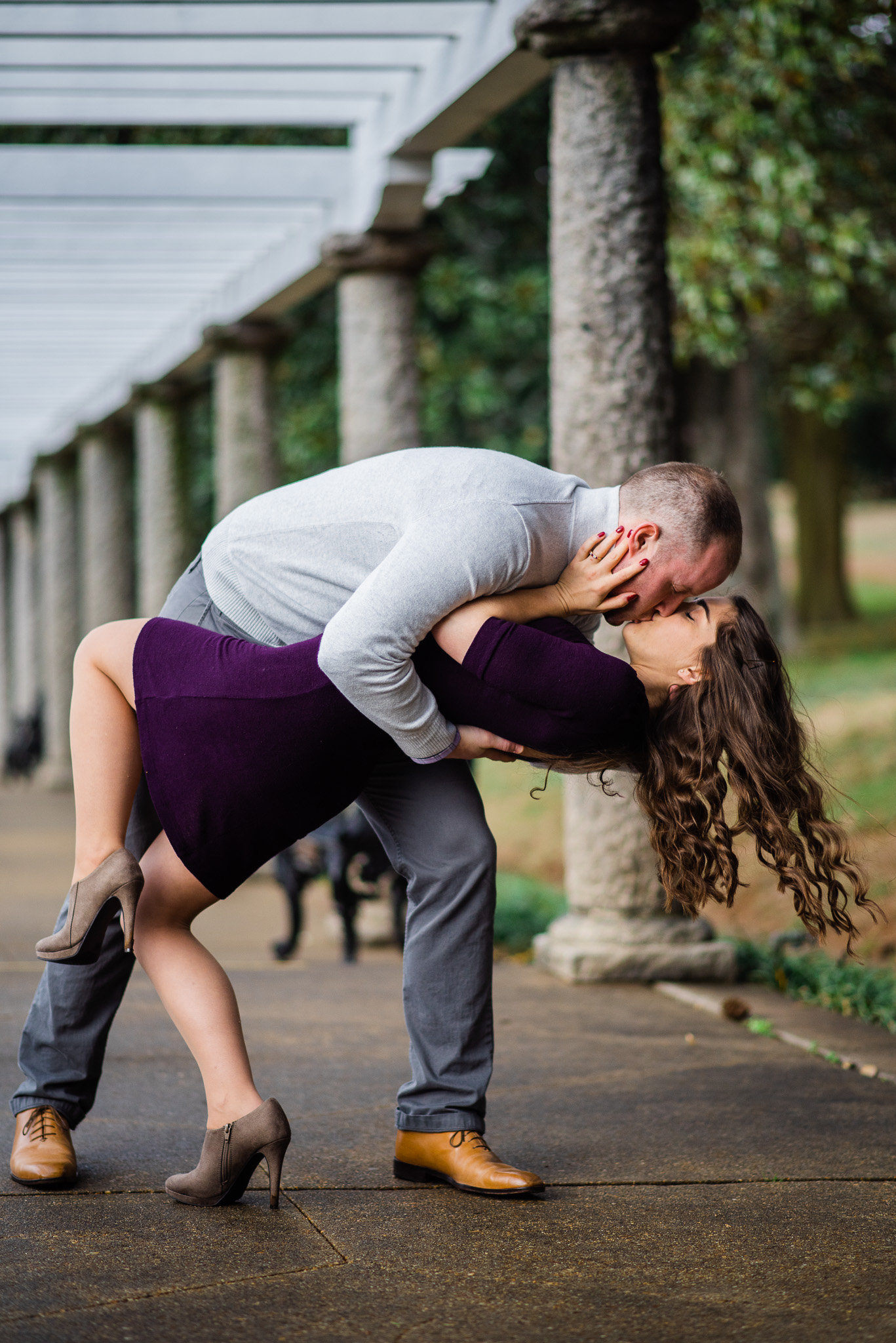 A man dipping his wife down for a kiss at Maymont Park in Richmond VA, basic invite